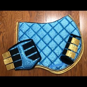 Sky Blue saddle pad and brushing boots! Jump cut